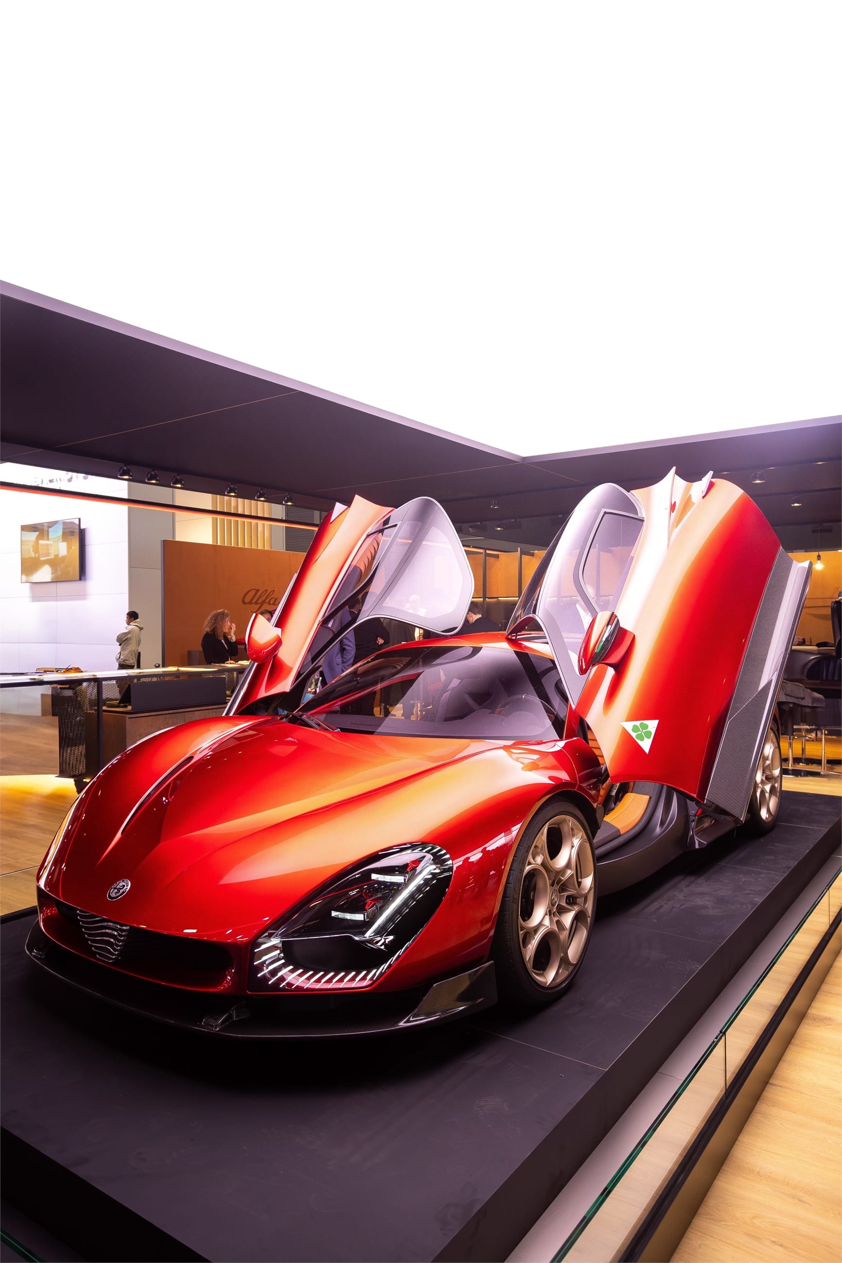 The coupe from the front three quarters, doors open.